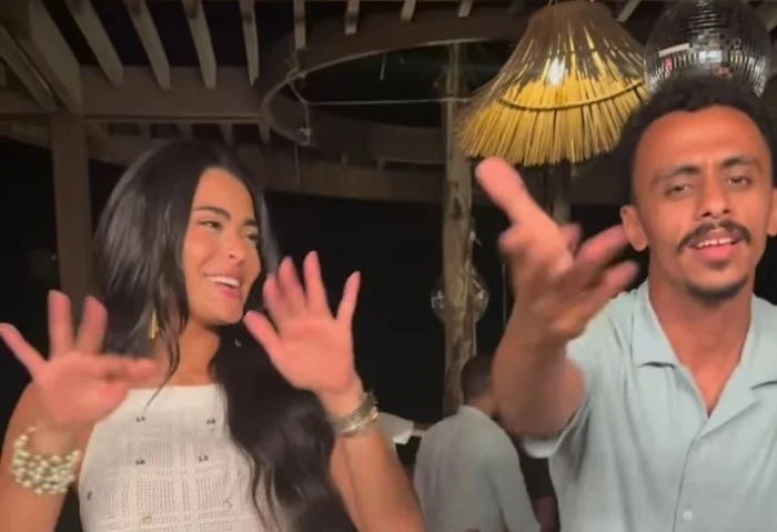 ربنا يبعد عننا العين، وصلة رقص بين كزبرة وأسماء جلال بعد أنباء زواجهما أثار مؤدي المهرجانات كزبرة، الجدل من جديد عبر مواقع التواصل الاجتماعي، حول