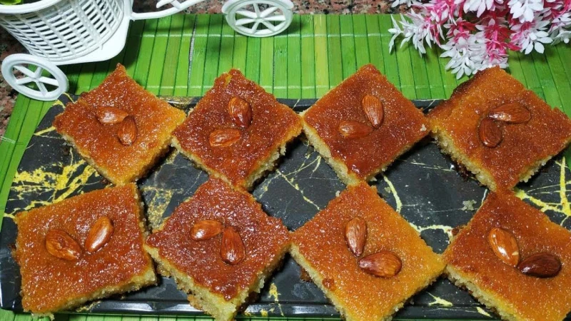 خطوات تحضير النمورة علي طريقة أكبر الحلوانية بمقادير مظبوطة وعلي قد الأيد وطعمه أكثر من رائعالنمورة من الحلويات الشرقية اللذيذة التي تذوب في الفم