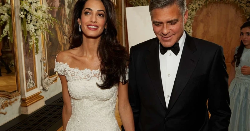 الفن و المشاهير: في الذكرى العاشرة لزواجها من جورج كلوني.. إليكم سعر فستان زفاف أمل كلوني الذي كان اخر ما صممه أوسكار دي لا رينتا يحتفل الممثل