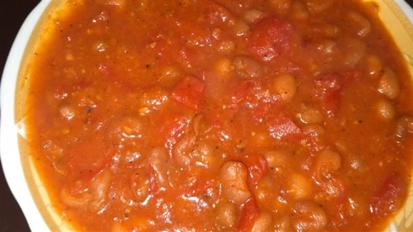 لعشاء شتوى مميز، طريقة عمل الفول بالطماطم فى خطوات بسيطة