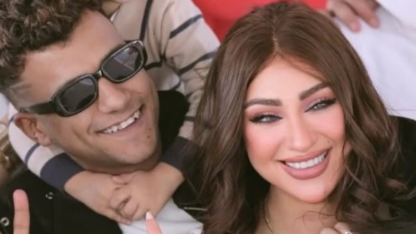 بألفاظ مشاجرة بين زوجة عصام صاصا وأشخاص في الشارع